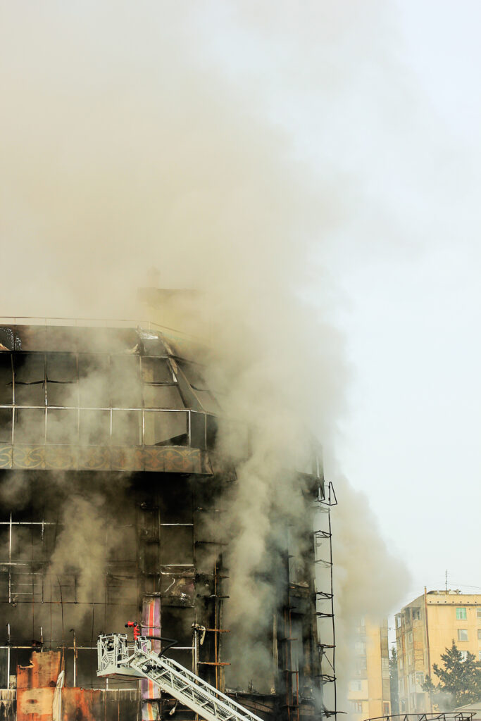 shopping center or mall fire,smoke,fighters,space for copy or te
