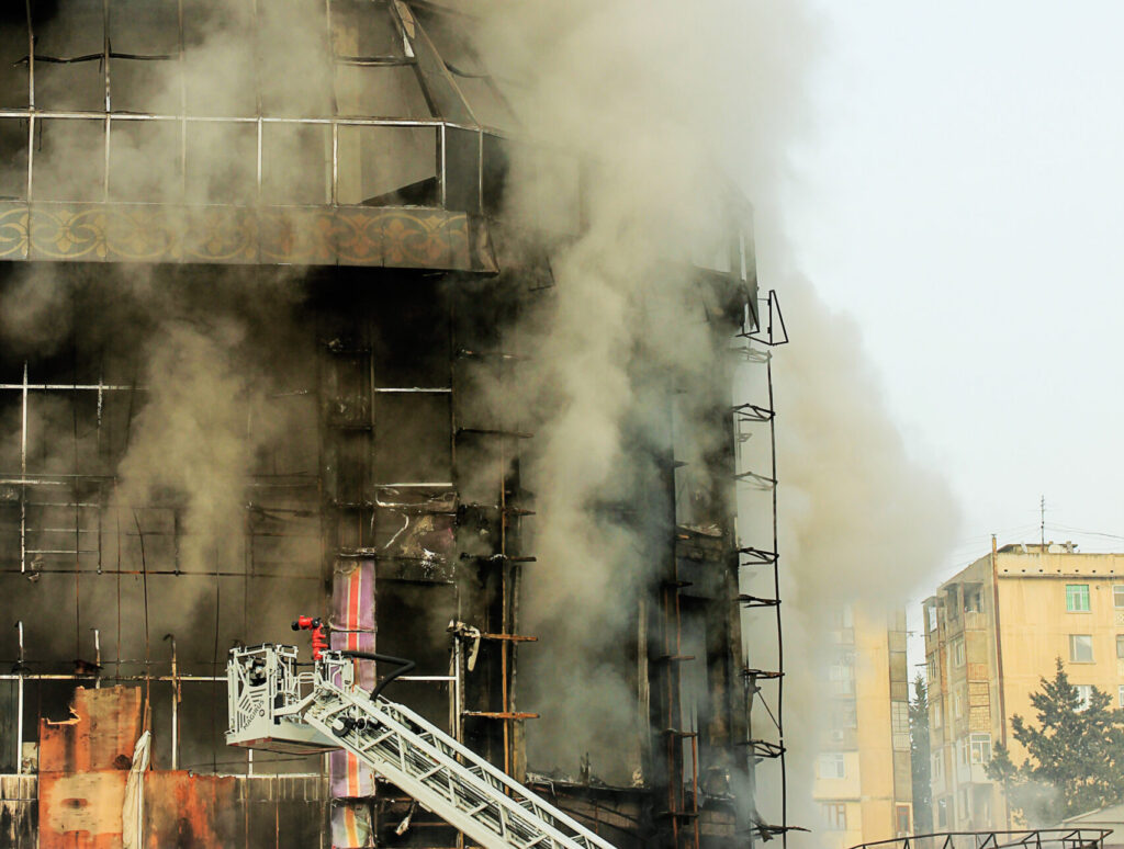 shopping center or mall fire,smoke,fighters,space for copy or te